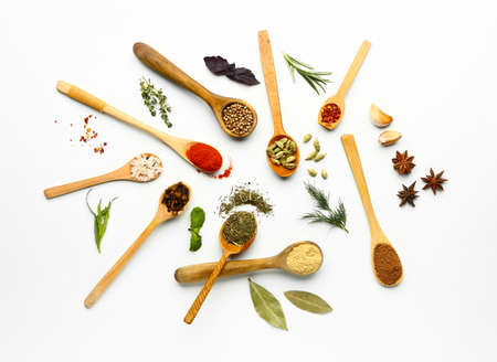 Many different spices on white background
