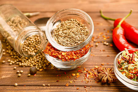 Many different spices on wooden backgroundの写真素材