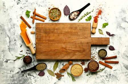 Composition with different spices on light background