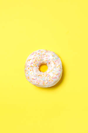Sweet tasty donut on color backgroundの写真素材