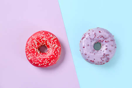Sweet tasty donuts on color backgroundの写真素材