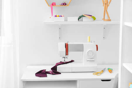 Tailor's workplace in modern atelier