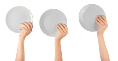 Hands with clean plates on white background