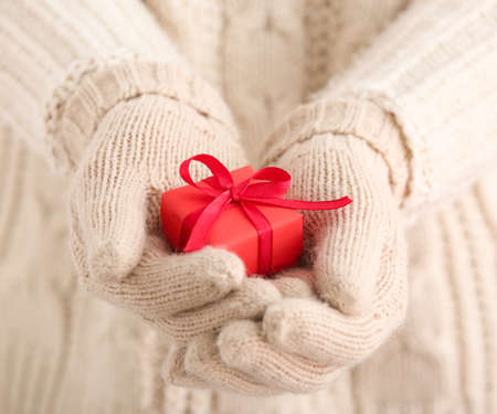 Woman with Christmas gift, closeupの写真素材