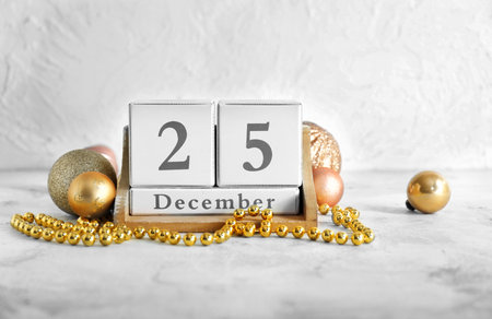 Calendar with date of Christmas and decor on tableの写真素材
