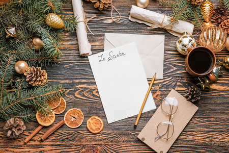 Christmas composition with empty letter to Santa Claus on wooden backgroundの写真素材