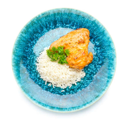 Plate with tasty rice and chicken on white backgroundの写真素材