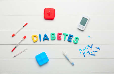 Composition with word DIABETES on white wooden backgroundの写真素材