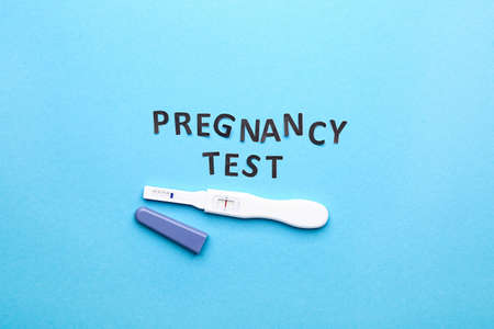 Pregnancy test on color backgroundの写真素材