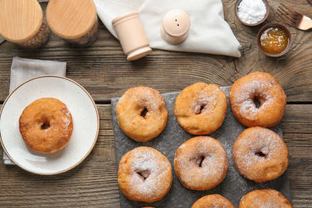 Sweet tasty donuts on table
