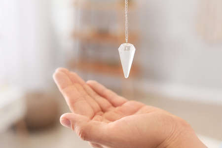 Reiki master with biolocation pendulum, closeupの写真素材