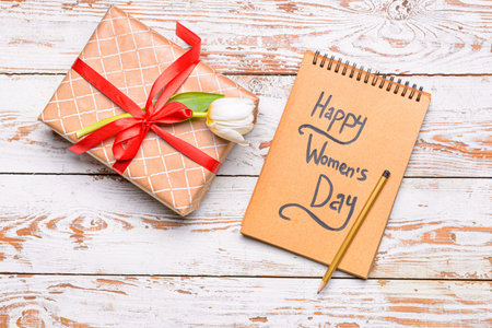 Composition for International Women's Day on white wooden background