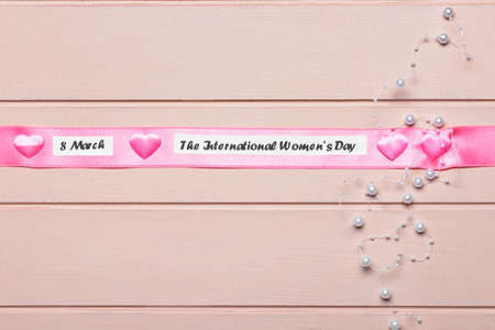 Composition for International Women's Day on white wooden backgroundの写真素材
