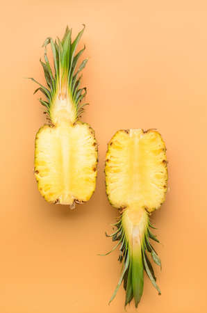 Fresh cut pineapple on color backgroundの写真素材
