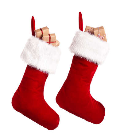 Christmas socks with gifts on white background