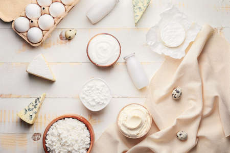 Different dairy products on wooden background