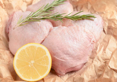 Raw chicken meat on parchmentの写真素材