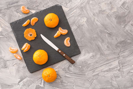 Composition with sweet tangerines on gray backgroundの写真素材