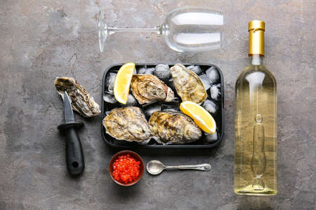 Composition with tasty oysters on tableの写真素材