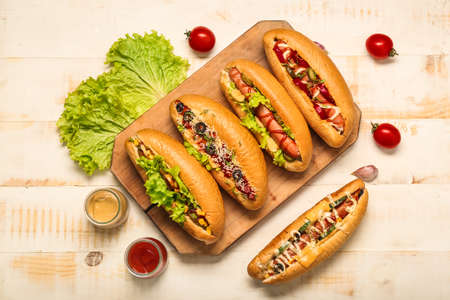 Tasty hot dogs on light tableの写真素材