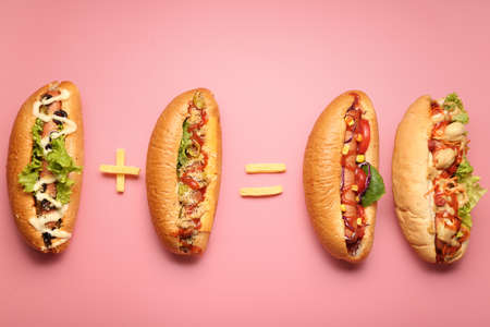 Composition with tasty hot dogs on color backgroundの写真素材
