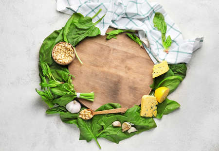 Composition with fresh green spinach on table