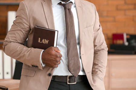 African-American lawyer with book in his officeの写真素材