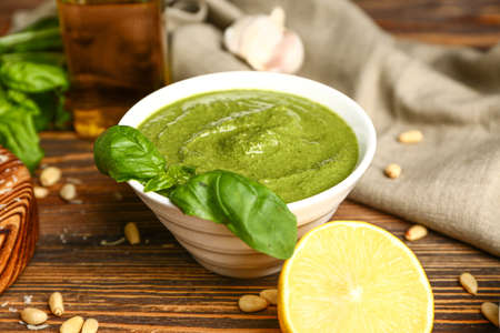 Pesto sauce in bowl on table