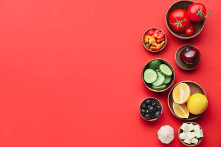 Ingredients for tasty Greek salad on color backgroundの写真素材