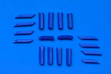 Raw painted pasta on blue backgroundの写真素材