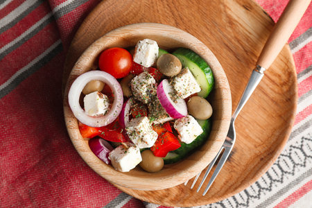 Bowl of tasty Greek salad on tableの写真素材