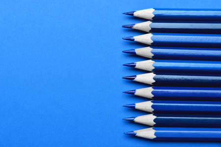 Blue pencils on color backgroundの写真素材