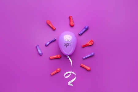 Air balloons on color background. April Fool's Day prankの写真素材