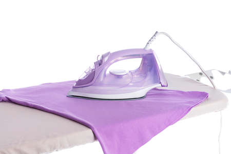 Electric iron and board on white backgroundの写真素材