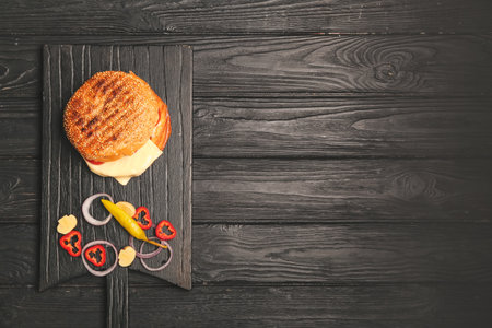 Tasty doner kebab in bun with vegetables on tableの写真素材