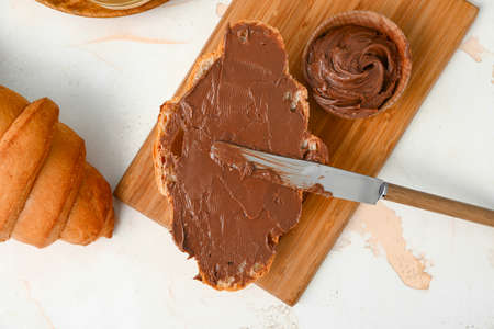 Tasty sweet croissants with chocolate on white backgroundの写真素材