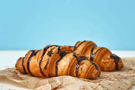 Tasty sweet croissants on tableの写真素材