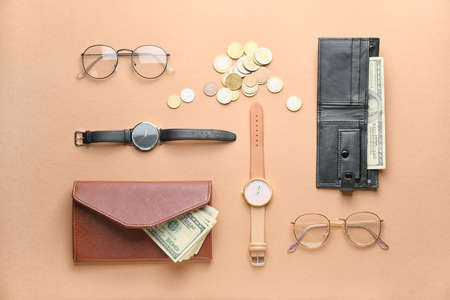 Wallets with money and accessories on color backgroundの写真素材