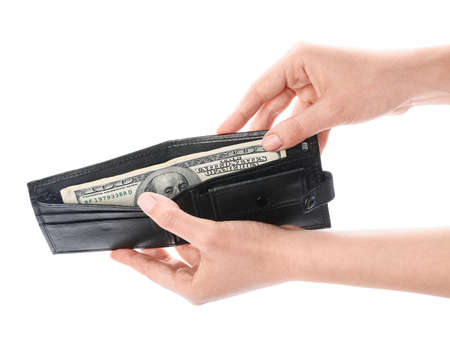 Female hands with wallet and money on white background