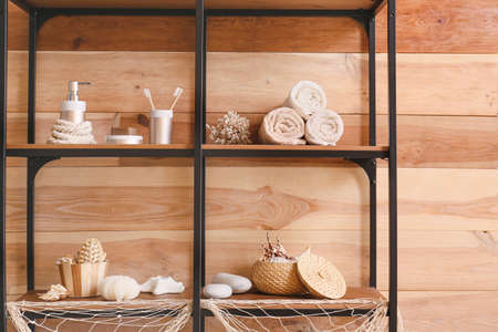 Beautiful marine decor on shelf unit in bathroomの写真素材