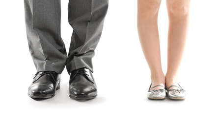 Legs of father and his little daughter on white backgroundの写真素材