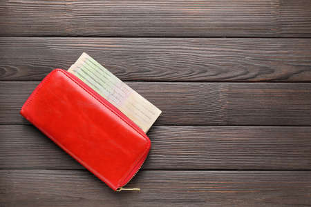 Wallet with money on wooden background. Savings conceptの写真素材