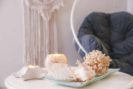 Beautiful marine decor on table in roomの写真素材