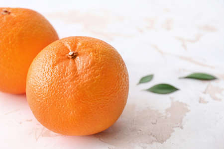 Sweet oranges on light background