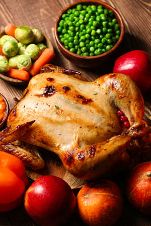 Tasty baked turkey and other dishes for Thanksgiving day on tableの写真素材