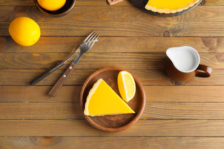 Composition with tasty lemon pie on wooden backgroundの写真素材