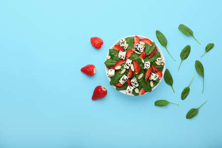 Bowl with tasty salad on color backgroundの写真素材
