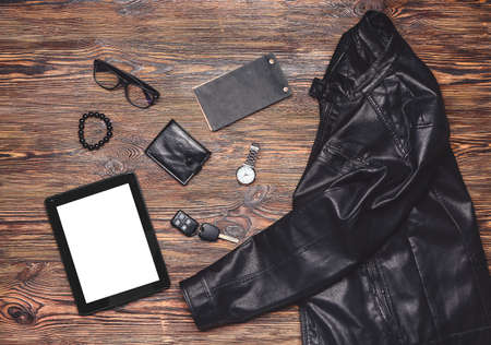 Stylish male clothes with accessories and tablet computer on wooden backgroundの写真素材