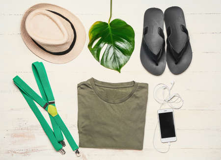 Stylish male clothes with accessories and mobile phone on white wooden backgroundの写真素材