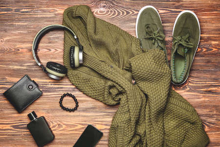 Stylish male clothes with accessories and devices on wooden backgroundの写真素材